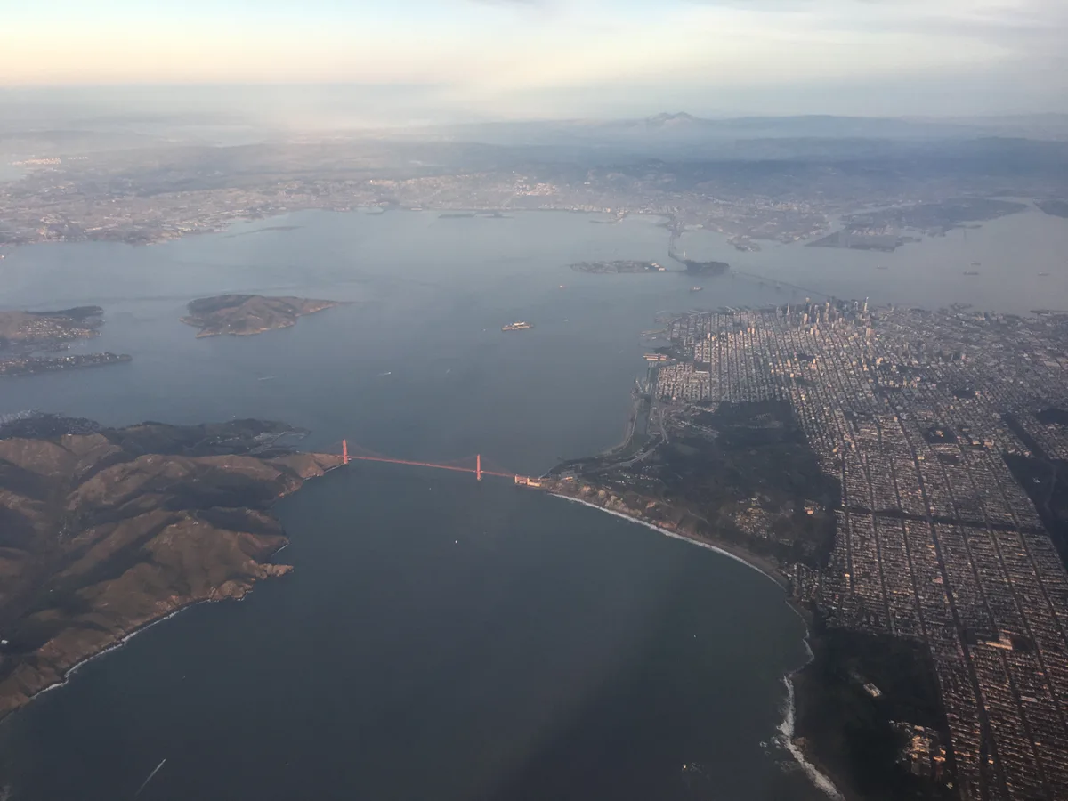 Aerial view across San Francisco Bay and the Golden Gate Bridge.